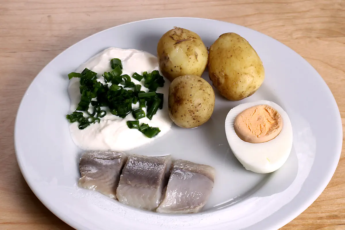 Gräddfil is a richer type of fermented dairy product, here served with chives and herring.