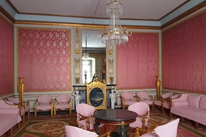 Rosersberg Palace, the Red Salon. The chairs are covered to protect them from sunlight. Photo: © StockholmMuseum.com