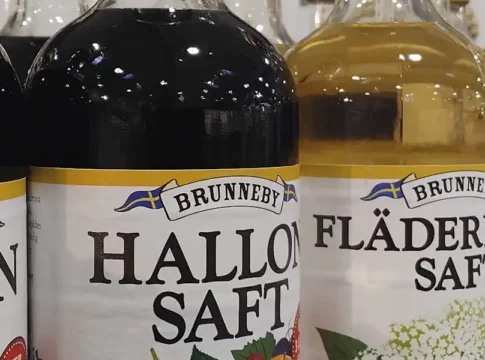 Bottles of saft (raspberry and elderflower) on a shelf in a typical Swedish grocery store. © StockholmMuseum.com